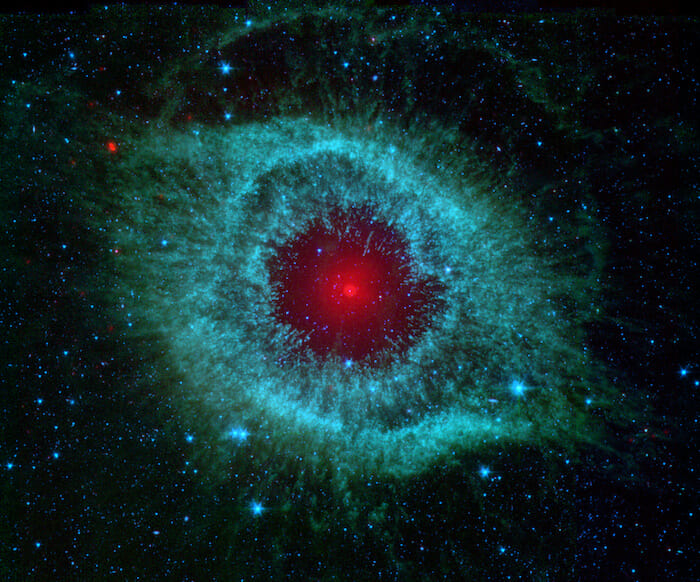 Unveiling Cosmic Beauty: NASA's Spitzer Space telescope Chronicles the Enchanting Helix Nebula